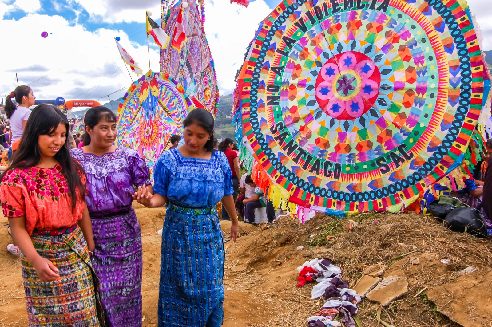 People flying kites together at a kite festival